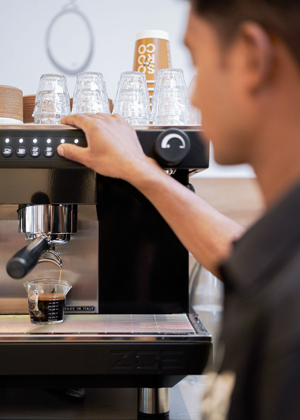 A barista pulling an espresso shot